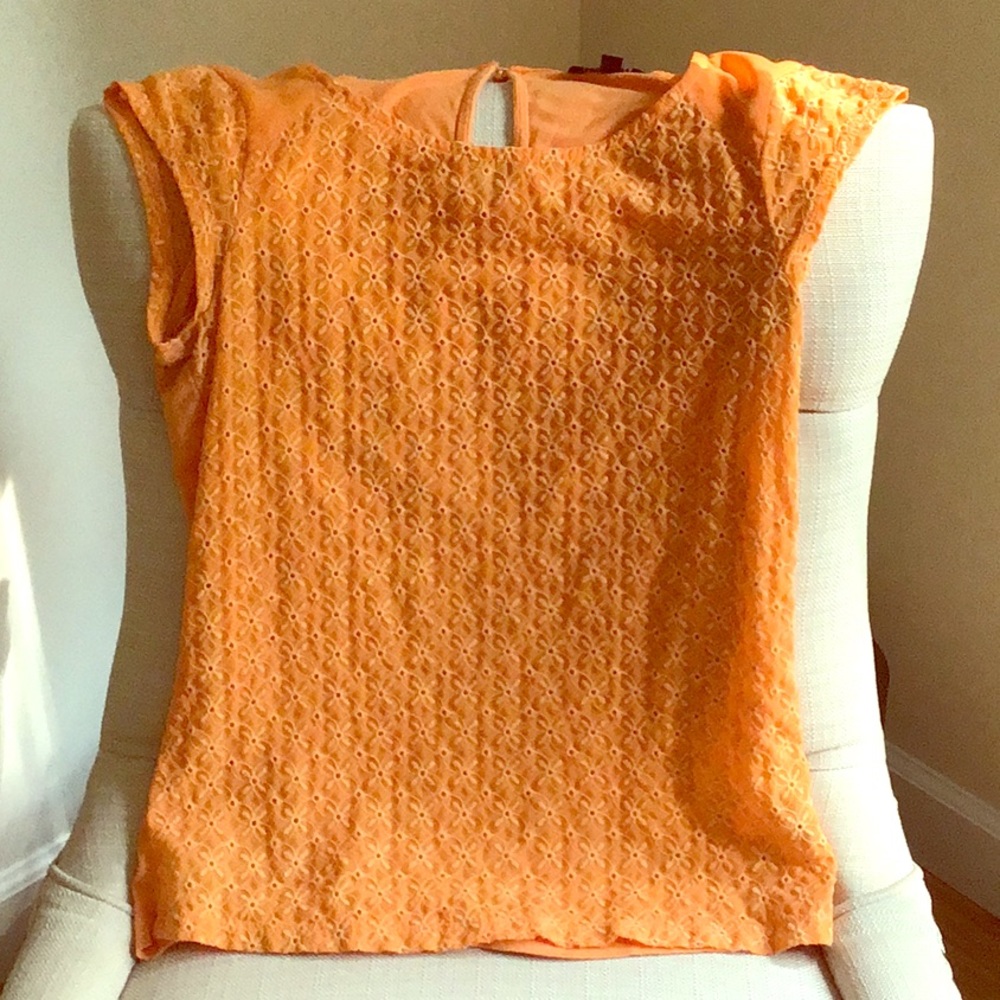 The limited Orange Eyelet Top